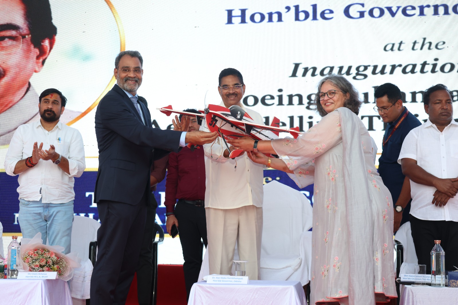 Hon'ble Governor receiving a memento by the representatives of The Boeing and The Kosala School.